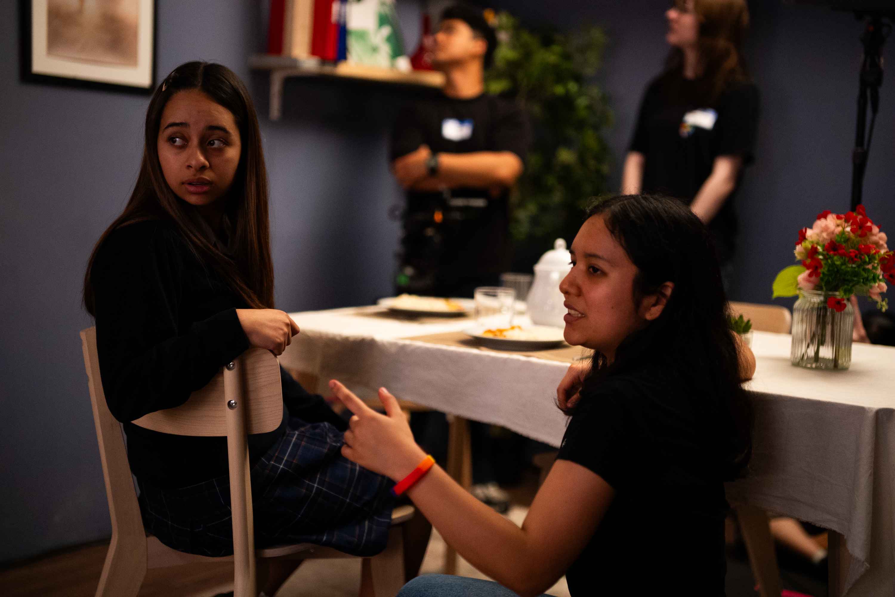 Cristina Caballero speaking with an actor between takes